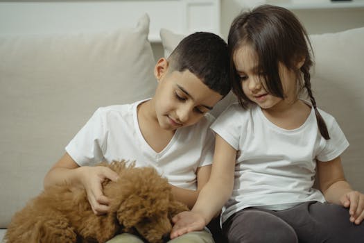 happy puppy playing with kids